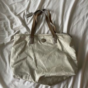 Coach bag with detachable pouch